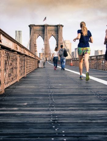 People running over a bridge