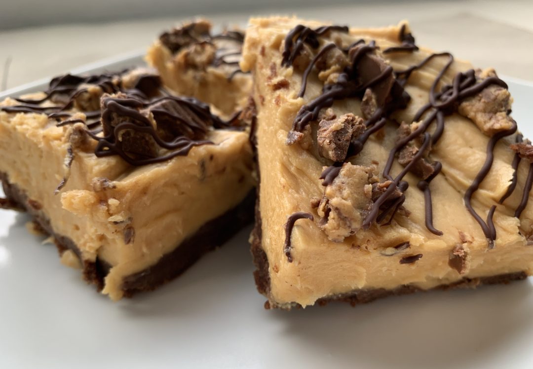 Peanut Butter Cheesecake Brownie Bar on white plate