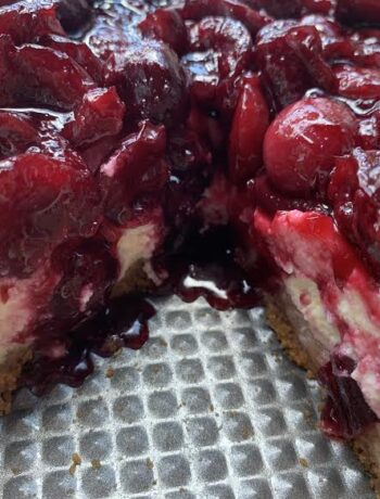 Fresh Cherry Cheesecake with slice cut out.