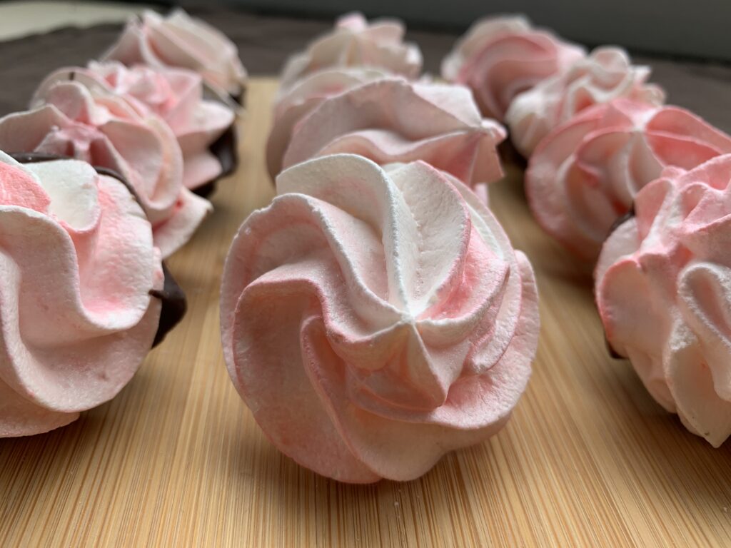 Rows of Chocolate Dipped Meringue Cookies