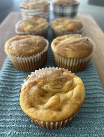 Pumpkin Cream Cheese Muffins on Teal Decorative Towel