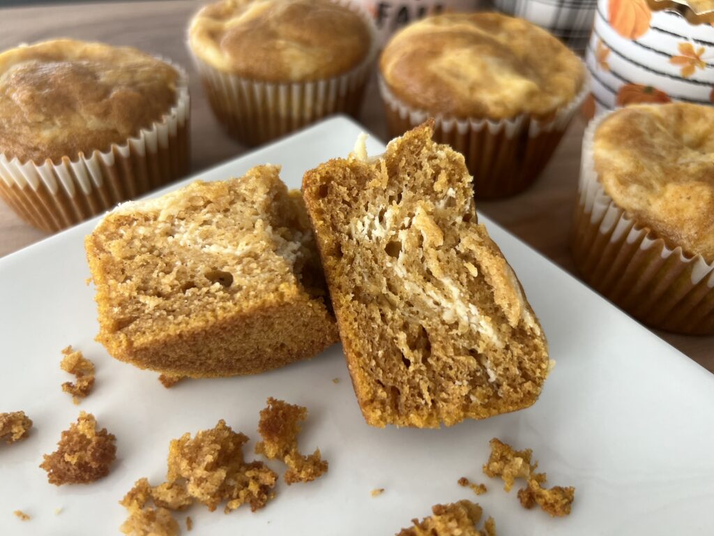 Pumpkin Cream Cheese Muffin on a white plate.