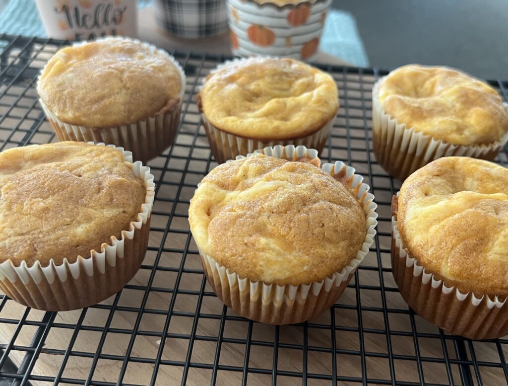 Pumpkin Cream Cheese Muffins on a wire rack.